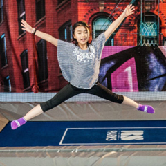Young female plays ValoJump trampoline game