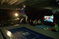 young male playing ValoJump trampoline park game