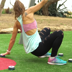 Female exercises with interactive BlazePods fitness lights