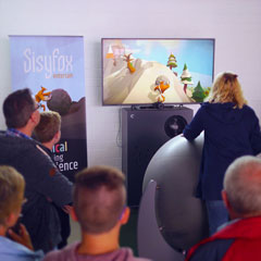 Kids and adlults playing SisyFox interactive games