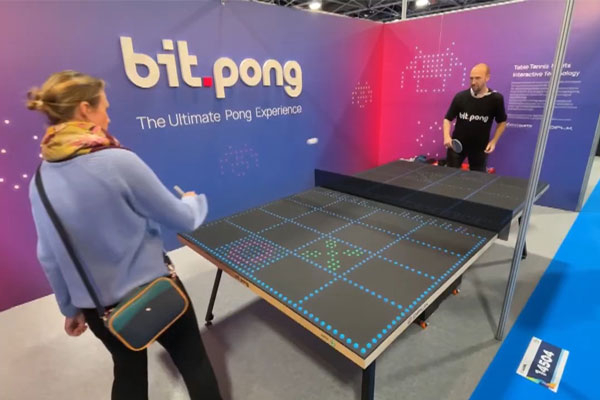 The Bit-Pong digital table tennis experience engaging visitors at a high-traffic expo booth