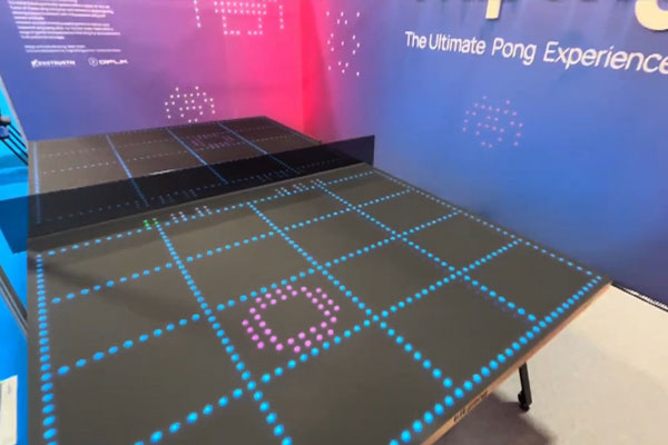 A Bit-Pong setup at a corporate exhibition captivating audiences