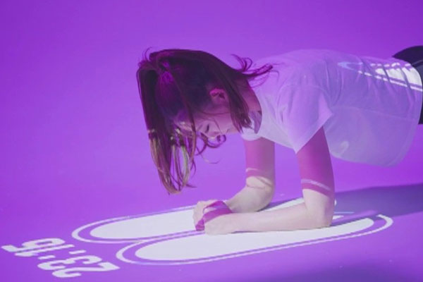 Young female exercising with DIDIM smart play floor
