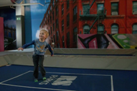 young child bouncing on trampoline while playing ValoJump