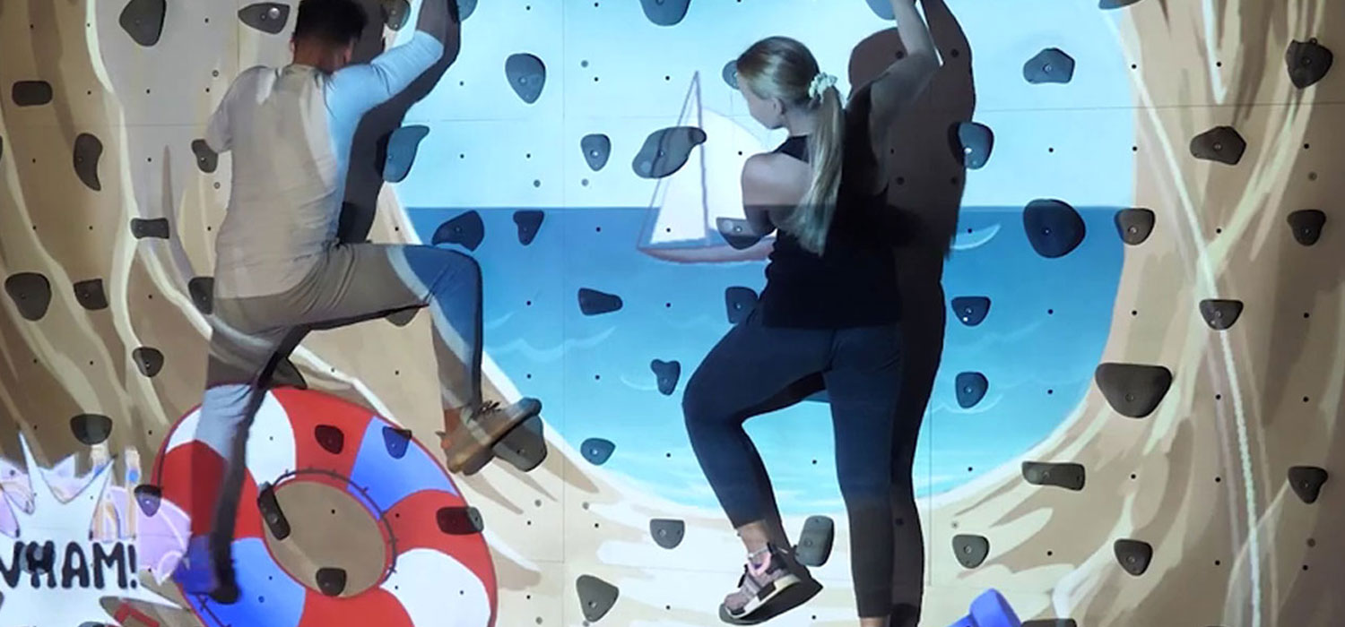 Interactive climbing wall with Whack-A-Bat game